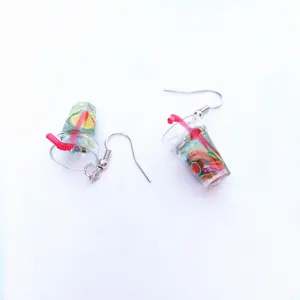 Resin fruit drink cup earrings detail closeup, cute miniature lemonade design with red straw.