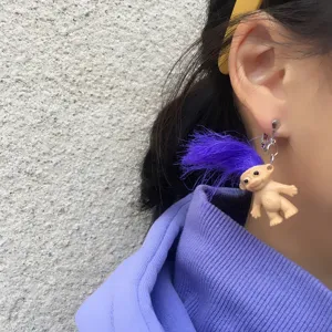 Creative handmade retro troll doll clip-on earrings with vibrant purple hair for women.