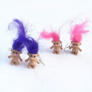 Retro funny troll doll earrings with colorful fluffy hair, quirky fashion statement jewelry.