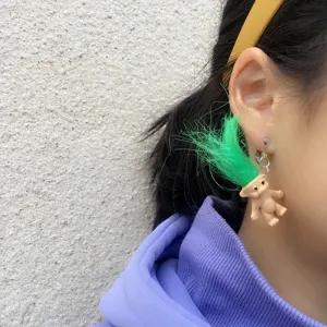Quirky retro troll doll clip-on earrings with bright green hair, funny vintage style jewelry.