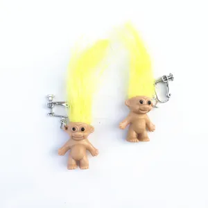 Vintage quirky troll doll clip-on earrings with bright yellow hair, fun fashion jewelry.