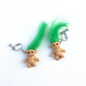 Retro troll doll clip earrings with bright green hair, funny quirky statement jewelry.