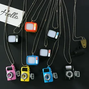 Retro camera and TV pendant necklaces with bead chains, colorful fashion hip-hop jewelry style.