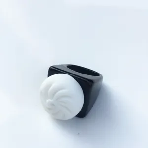 Novelty resin acrylic ring with cute white food bun design and black wide band for women.