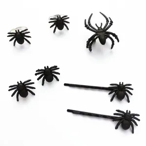 Black spider hairpins rings detail shot, Halloween gothic party cosplay accessories set.