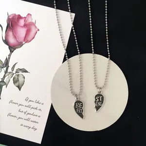 Matching best friend broken heart pendant necklace set with silver bead chain for couple.