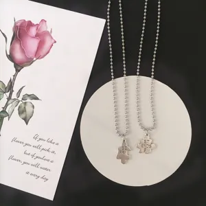 Silver bead chain necklace set with puzzle pendants, matching best friends jewelry accessory.