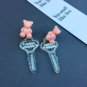 Cute pink resin bear and transparent glitter key drop earrings for sweet style daily wear.