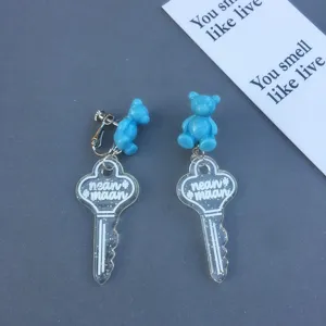 Blue cute bear clear key acrylic earrings detail view, sweet niche design fashion jewelry drops.