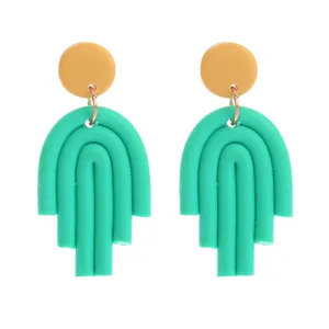 Handgemachte Polymer Ton grüne Bogen Ohrringe mit gelben Kreis Ohrstecker Schmuck.