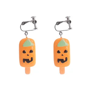 Cute Halloween pumpkin popsicle resin clip-on earrings, fun food play novelty jewelry.