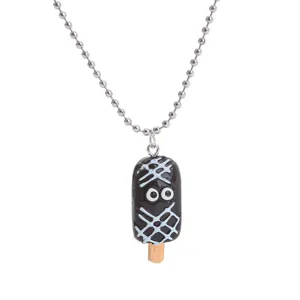 Detailed shot of a cute chocolate ice pop pendant necklace with funny eyes and ball chain.