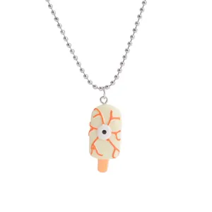 Halloween eyeball popsicle necklace, resin food play pendant with silver-toned ball chain.