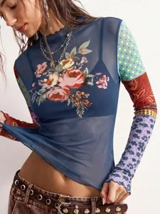 Close-up of the vintage floral mesh top featuring patchwork sleeves, lettuce trim and long sleeves.