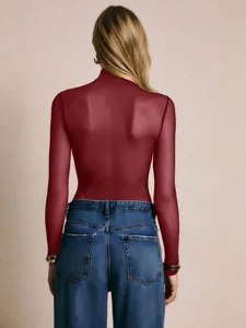 Sexy sheer dark red long sleeve bodysuit paired with blue jeans for women, stylish autumn wear.