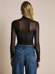 Back view of a sexy sheer mesh long sleeve bodysuit paired with classic blue denim jeans.