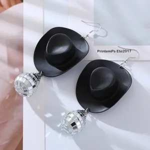 Close-up detail of black cowboy hat and mirror disco ball dangling earrings, punk style.