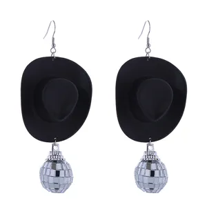Detailed close-up shot of the black cowboy hat and glittering silver disco ball earrings.