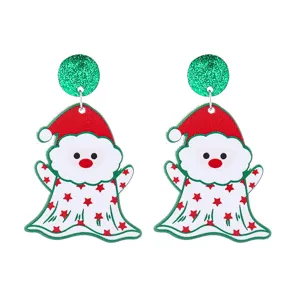 Close-up detail of festive Christmas acrylic earrings with glitter studs and cute holiday charms.