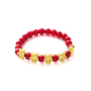 Rotes Perlenarmband mit goldenen Cartoon-Drachen-Anhängern, Glücks-Zodiac-Geschenk für das Jahr 2024.