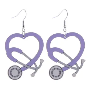 Detail view of purple wooden stethoscope heart earrings, medical nurse jewelry accessory.