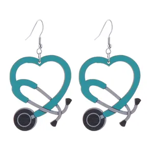 Close-up view of wooden stethoscope heart earrings, perfect nurse medical theme jewelry.