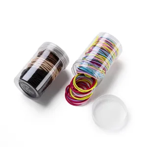 Detailed view of canned colorful thin hair ties, high elasticity rubber bands in clear jar.