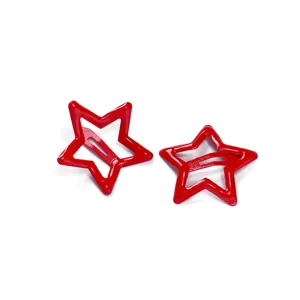 Red metal star hair clip detail shot, cute hollow snap clip for kids daily hair styling.