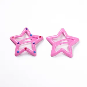 Pink star hair clips detail, cute metal BB clips with colorful dot accents for kids.