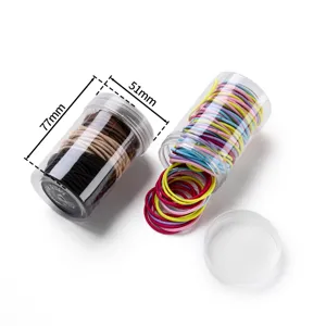 Clear jar container detail showing colorful and neutral elastic hair bands with size specs