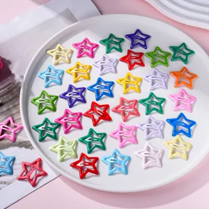 Close up detail of colorful star hair clips, cute metal BB clips set for kids hair styling.