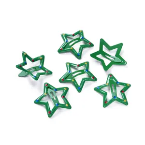 Detailed shot of green star metal snap hair clips with colorful dotted decor for kids.