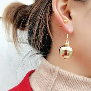 Vintage retro disco ball dangle earrings for women, gold metallic spherical hook jewelry.