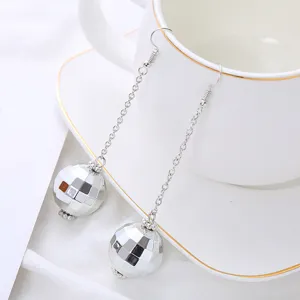 Detailed view of retro disco ball long chain earrings, featuring shiny mirrored spherical design.