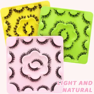 Close-up display of colorful fluffy false eyelashes on square trays, natural curly style detail.
