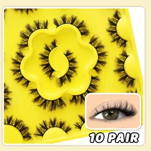 Close-up of 10 pairs fluffy false eyelashes on yellow tray showing dramatic volume and curl effect.