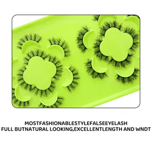 Pestañas postizas dramáticas con bandeja verde, ideales para maquillaje y fiestas.