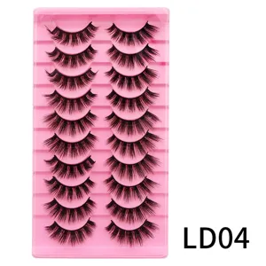 Nahaufnahme von 10 Paar künstlichen Wimpern auf rosa Schale, L-Schwung Detailansicht.