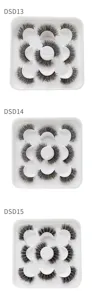 Detailansicht von segmentierten fluffigen künstlichen Wimpern im weißen Schalen-Set.