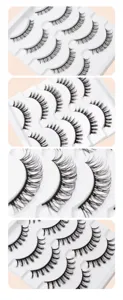 Nahaufnahme im Detail von verschiedenen künstlichen Wimpern auf weißer Plastikschale.