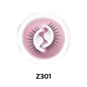 Selbstklebende künstliche Wimpern im Detail mit runder rosa Glitzer Aufbewahrungsbox.