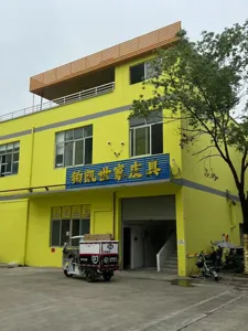 Factory exterior view showing leather goods manufacturing supplier and transport vehicle.