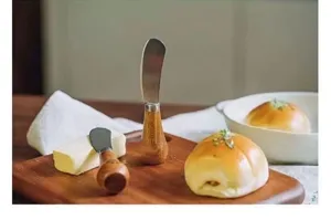 Wooden handle butter knife spreader for bread, jam, and cheese. Stainless steel blade.