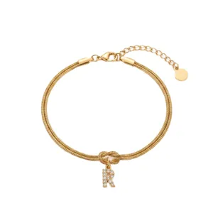 Gold initial R bracelet with sparkling zircon crystal pendant and double snake chain.
