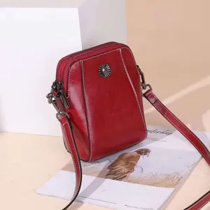Red oil wax leather crossbody phone bag detail, stylish women single shoulder bag for daily use.