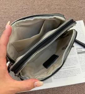 Genuine leather double zipper wallet interior detail showing multi compartments and card slots.