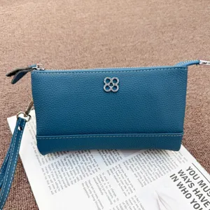 Genuine leather coin purse and wristlet bag, stylish blue clutch for women with metal clover.