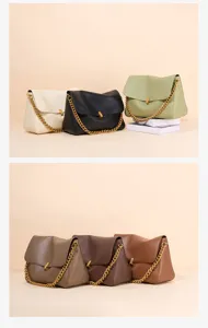 Detailed view of stylish leather shoulder bags with chunky chains and chic metallic clasps.