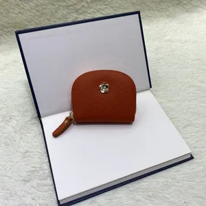 Mini leather coin purse card holder with cute flower hardware and half round design.
