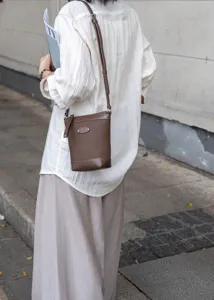 Genuine leather crossbody bag for women, stylish brown shoulder phone bag for daily commute.